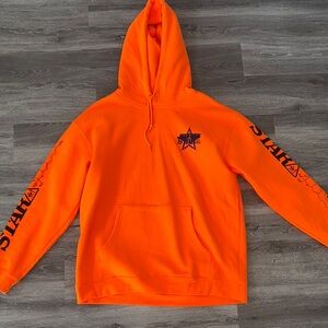 Jeffree Star Orange Hoodie with Bold Graphics